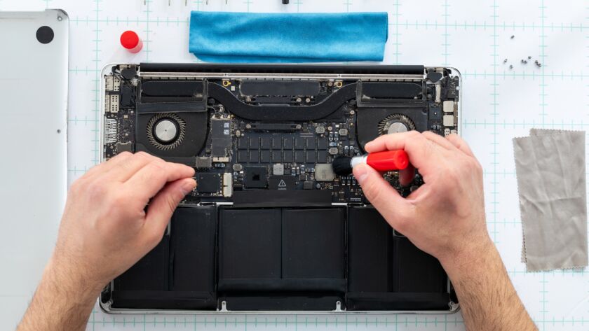 Computer technician fixing a PC